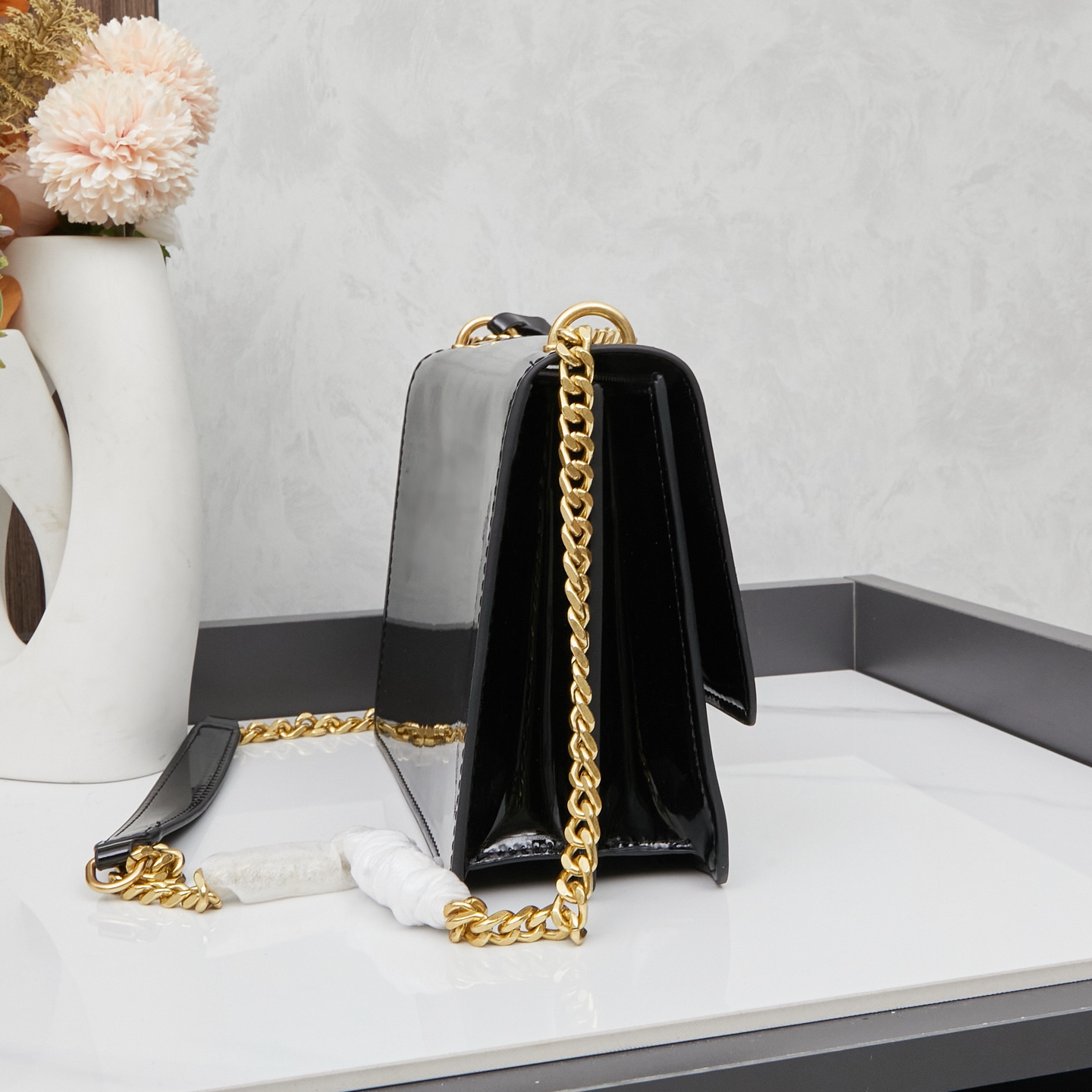 SAINT LAURENT Jamie Lacquered leather handbag Black